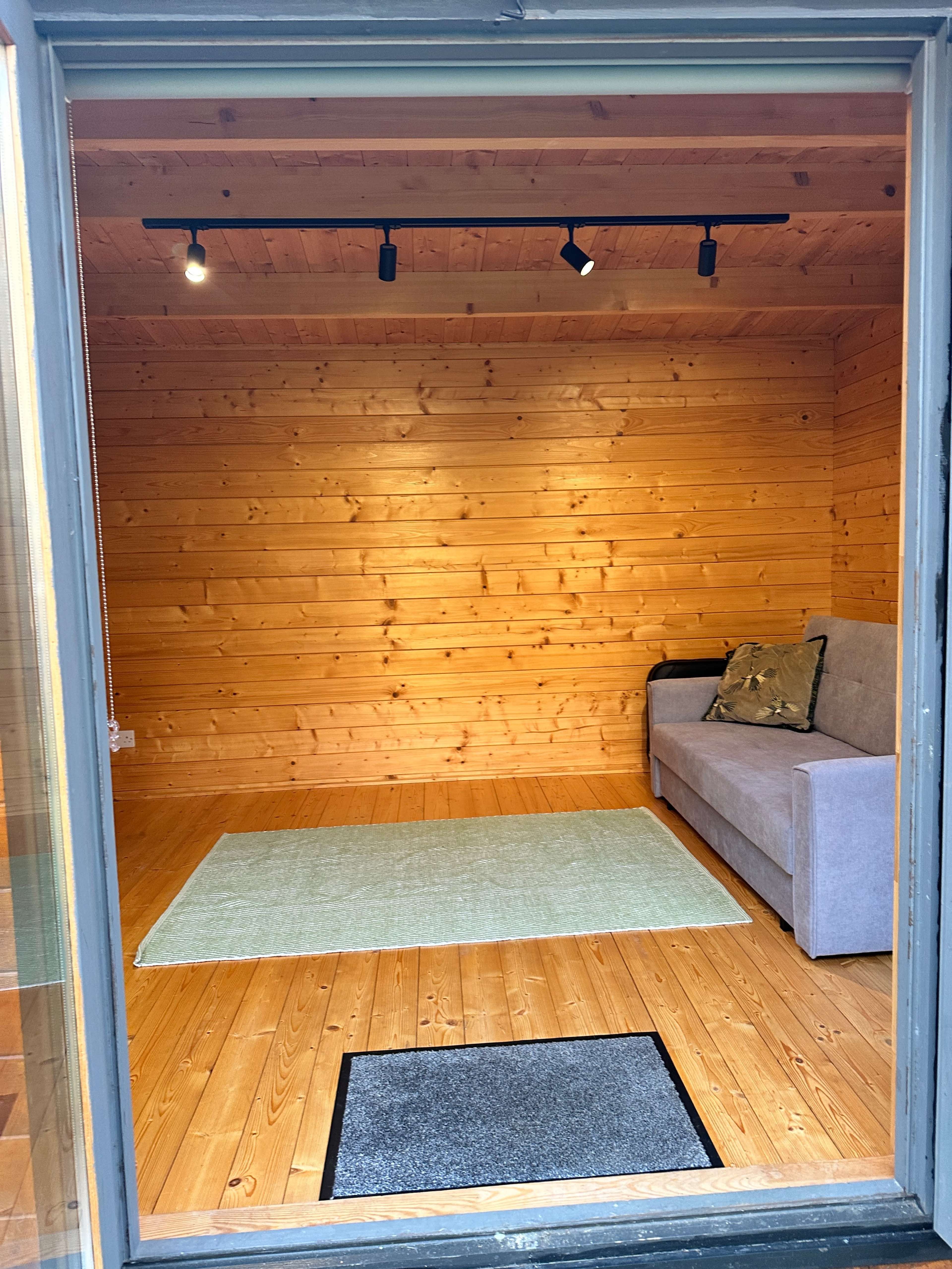 light-filled log cabin with ensuite bathroom Image in Raynes Park, london, ENG