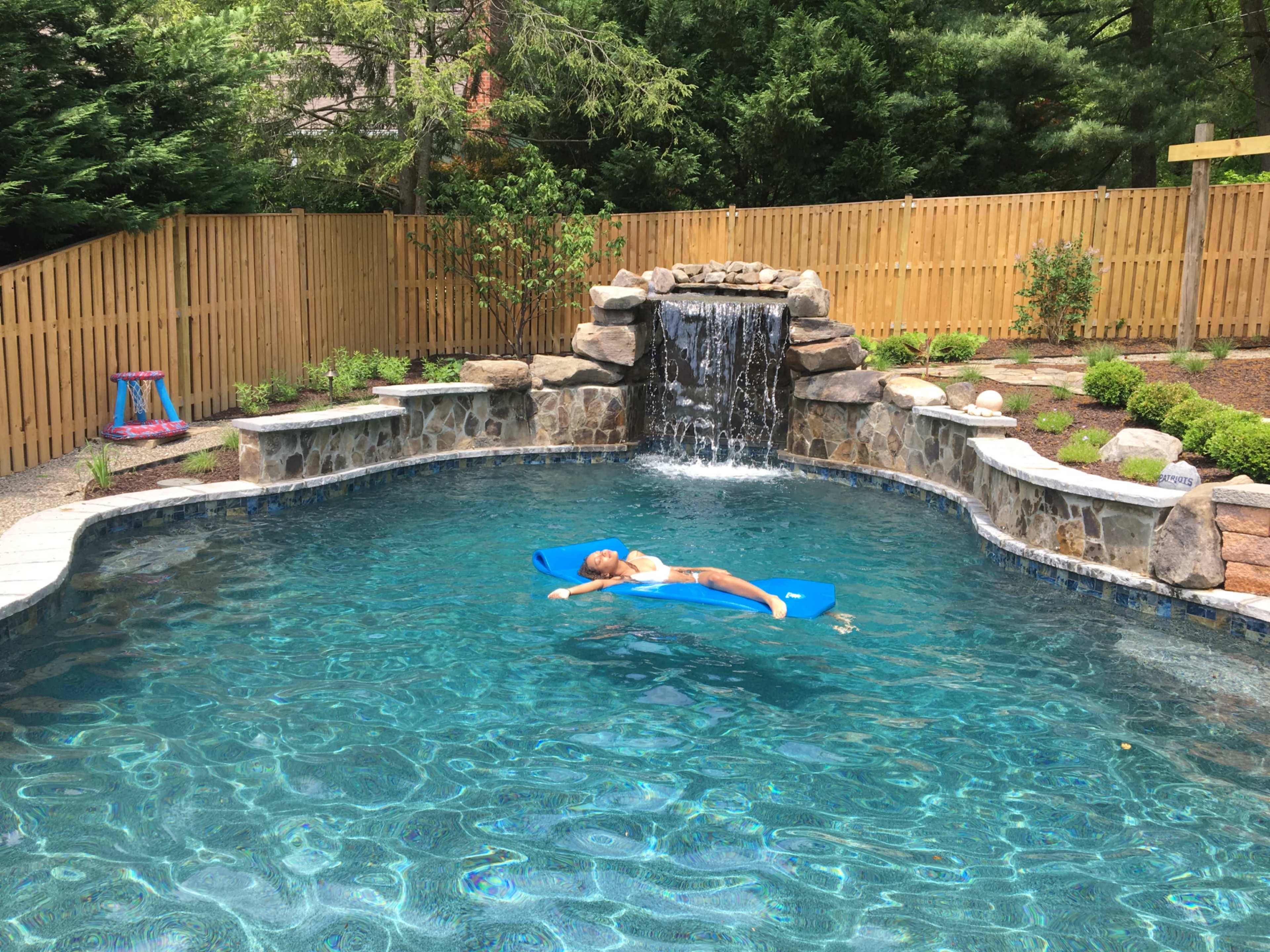 Pool with grotto surrounded by  tropical gardens Image in Savage, Savage, MD