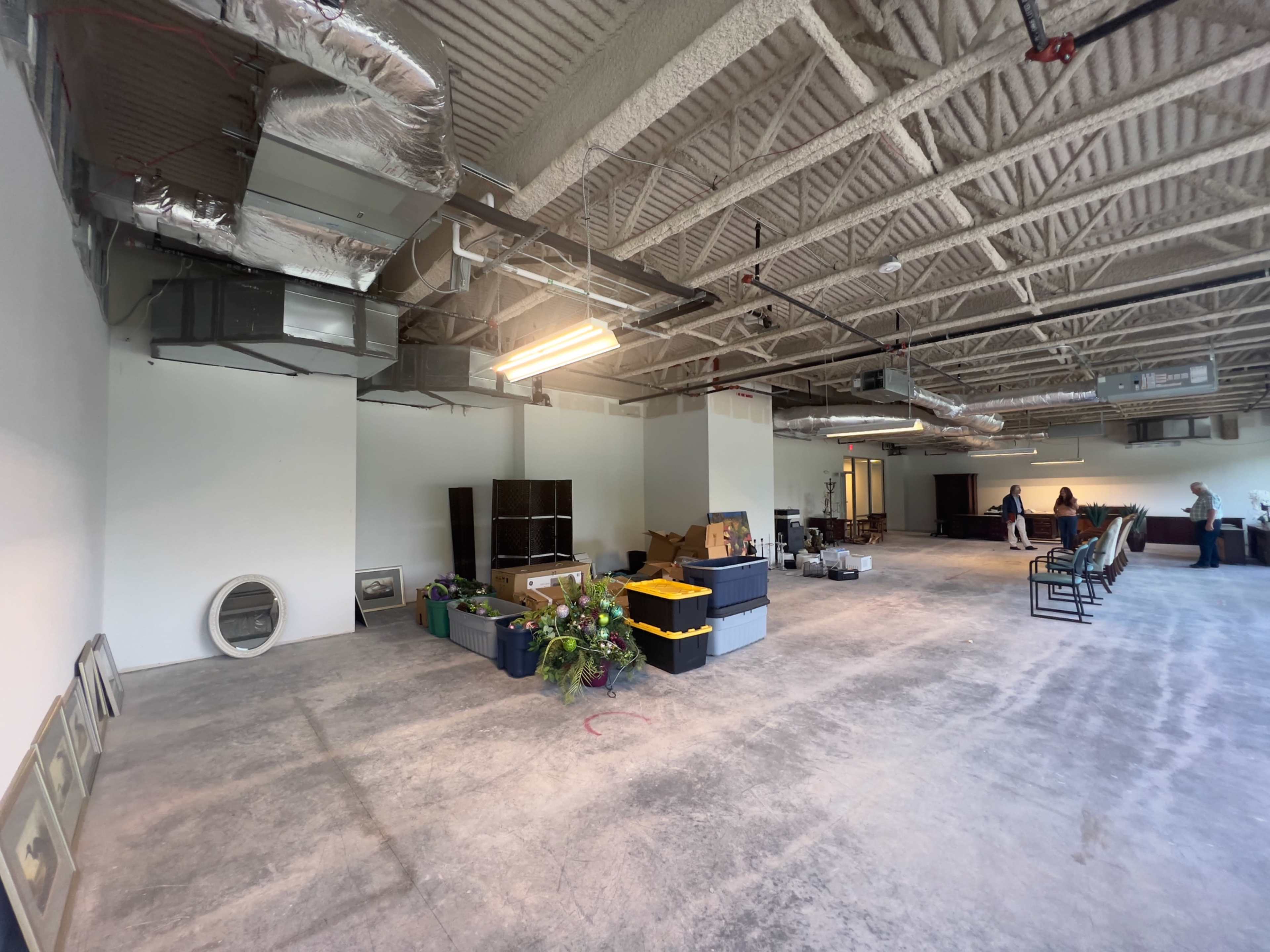 Industrial Studio space, white walls, concrete floors, high ceilings. Image in Central Newport News, Newport News, VA