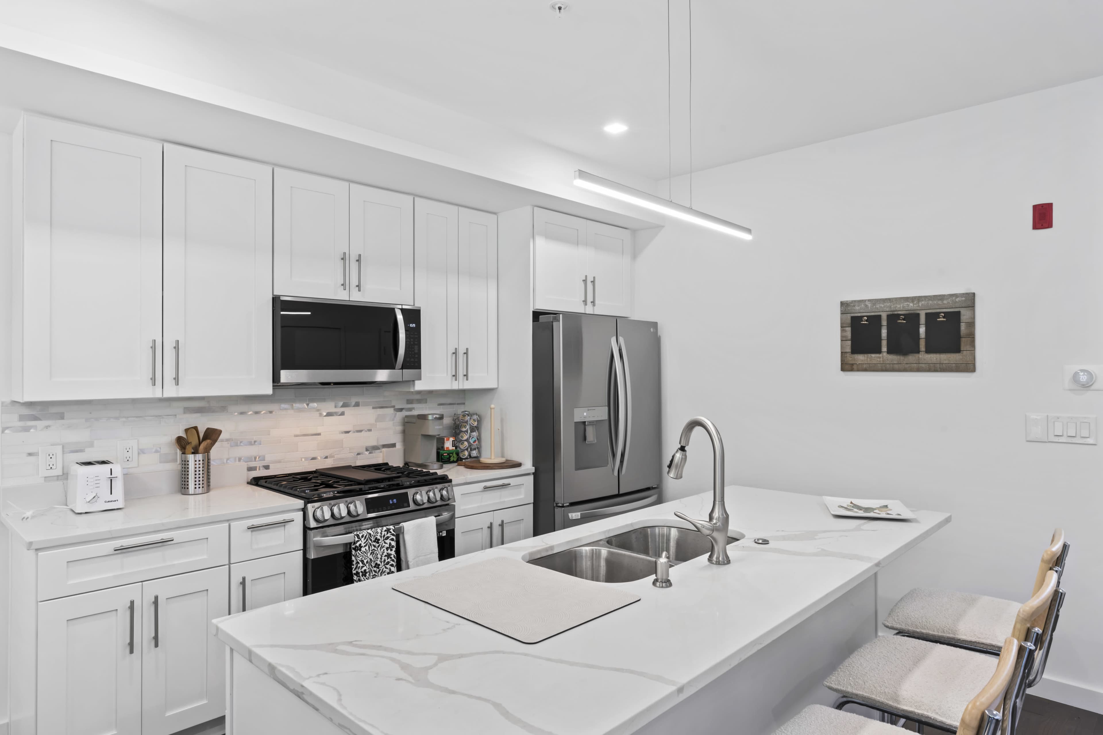Fully furnished 3-bedroom apartment ideal for filming. Features stylish modern decor, natural light, spacious living areas, and a functional kitchen. Versatile layout perfect for a variety of scenes. Ready for cast and crew use. Image in Northeast Washington, Washington, DC