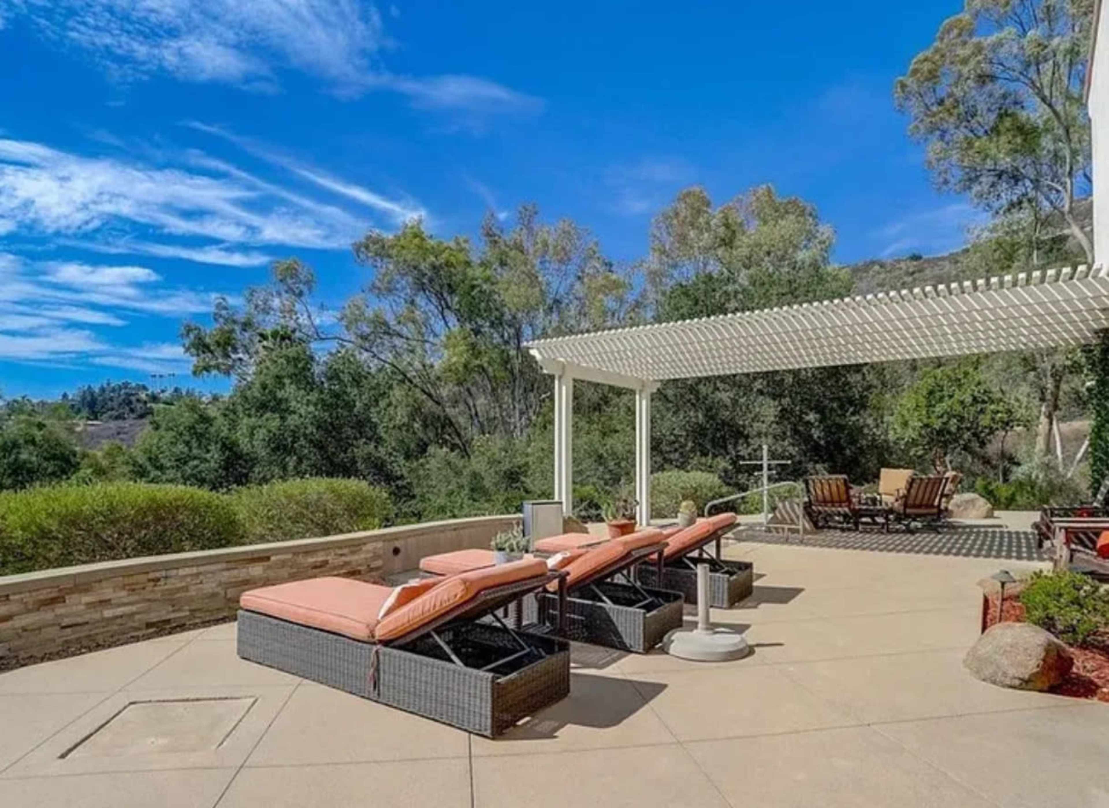 Modern Outdoor Pool Area with Golden Hour Views Image in Hidden Meadows, Escondido, CA