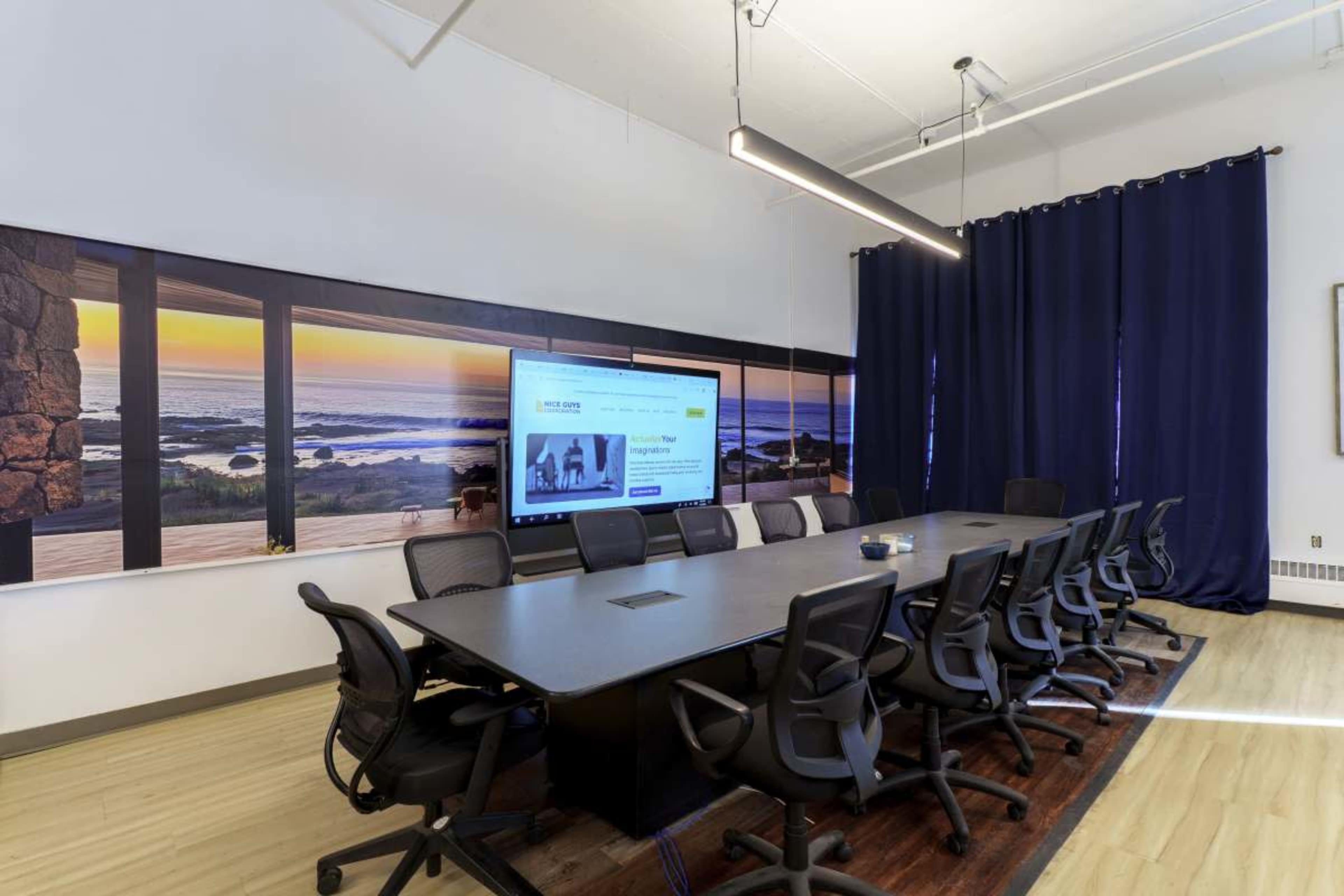 Meeting Space, 14 chairs, conference table, touch screen interface 86" conference monitor Image in Hawthorne, Minneapolis, MN