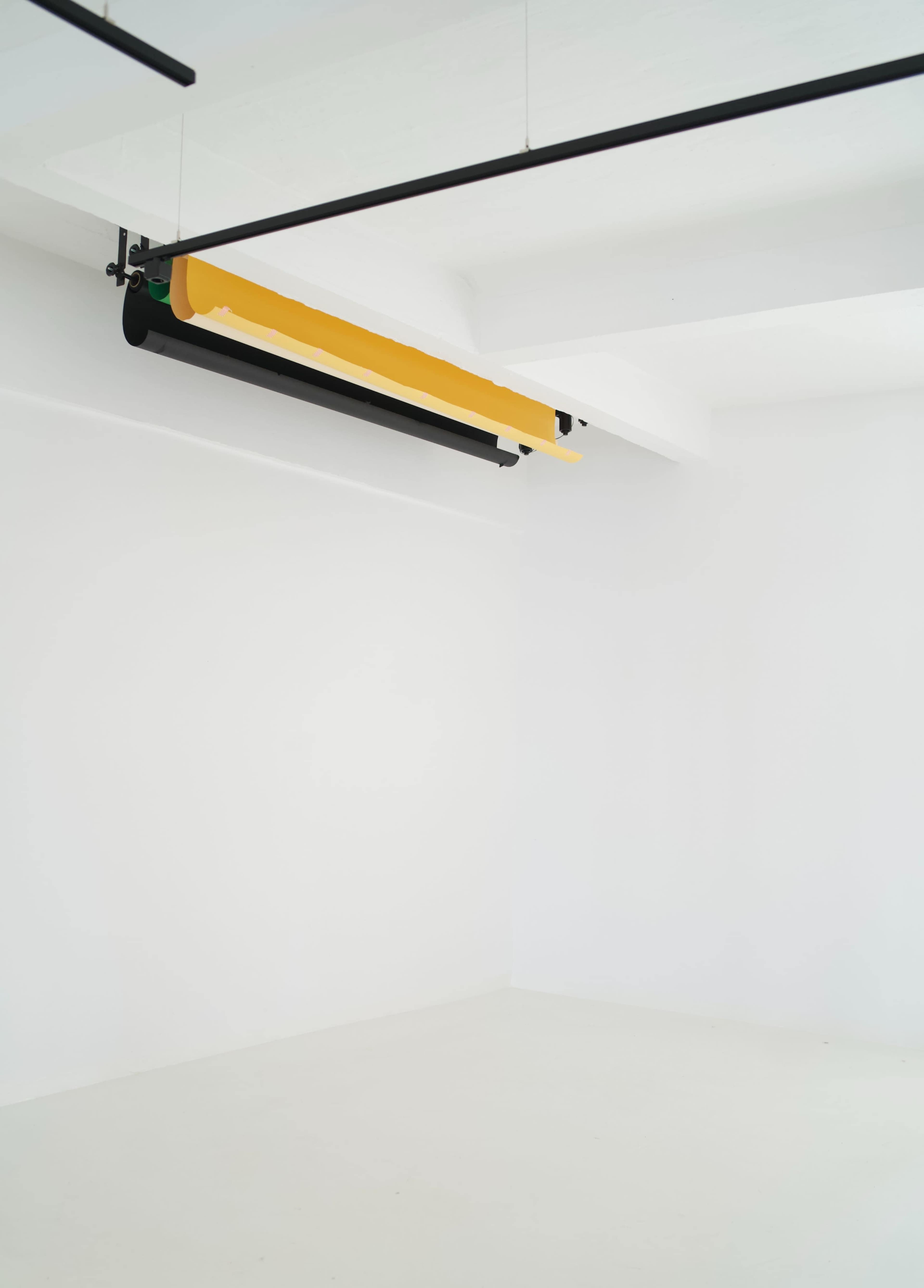 The image shows a minimalist white room with a yellow and black overhead light fixture.