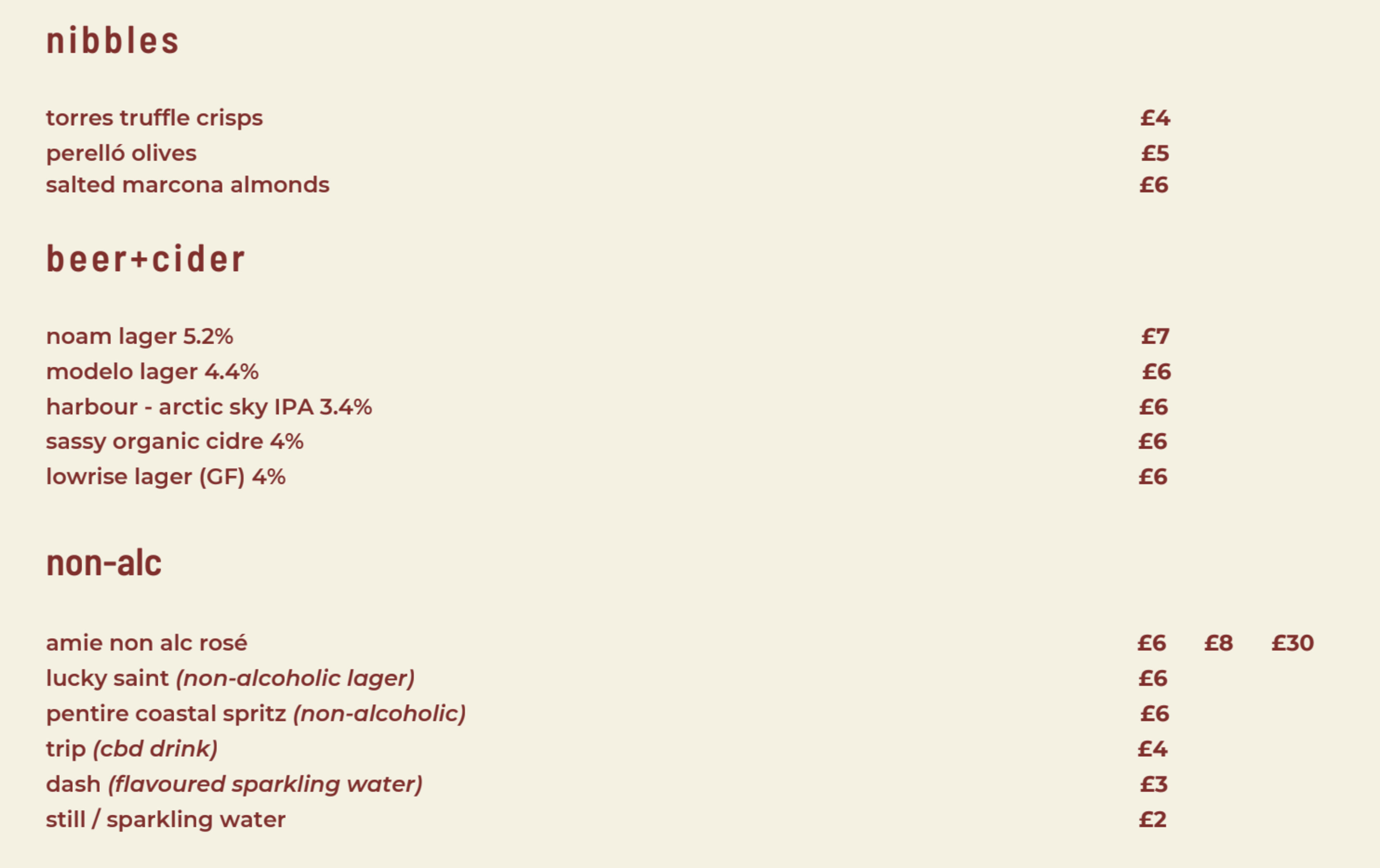 The image displays a menu with sections for nibbles, beer and cider, and non-alcoholic beverages, each listing items along with their prices.