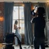 Behind the scenes film shoot in large warehouse with ceiling lights
